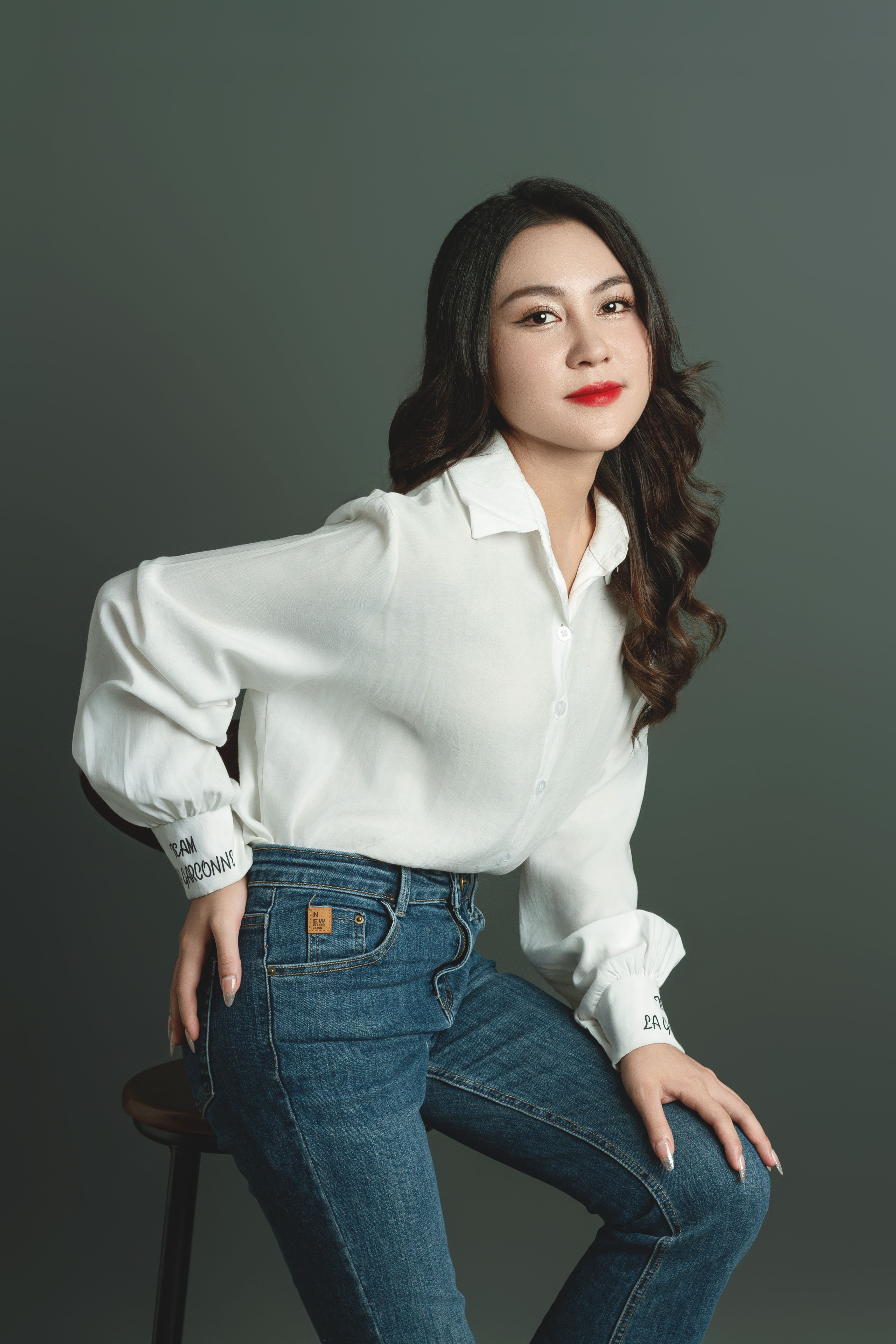 Woman Posing in a Shirt and Jeans · Free Stock Photo