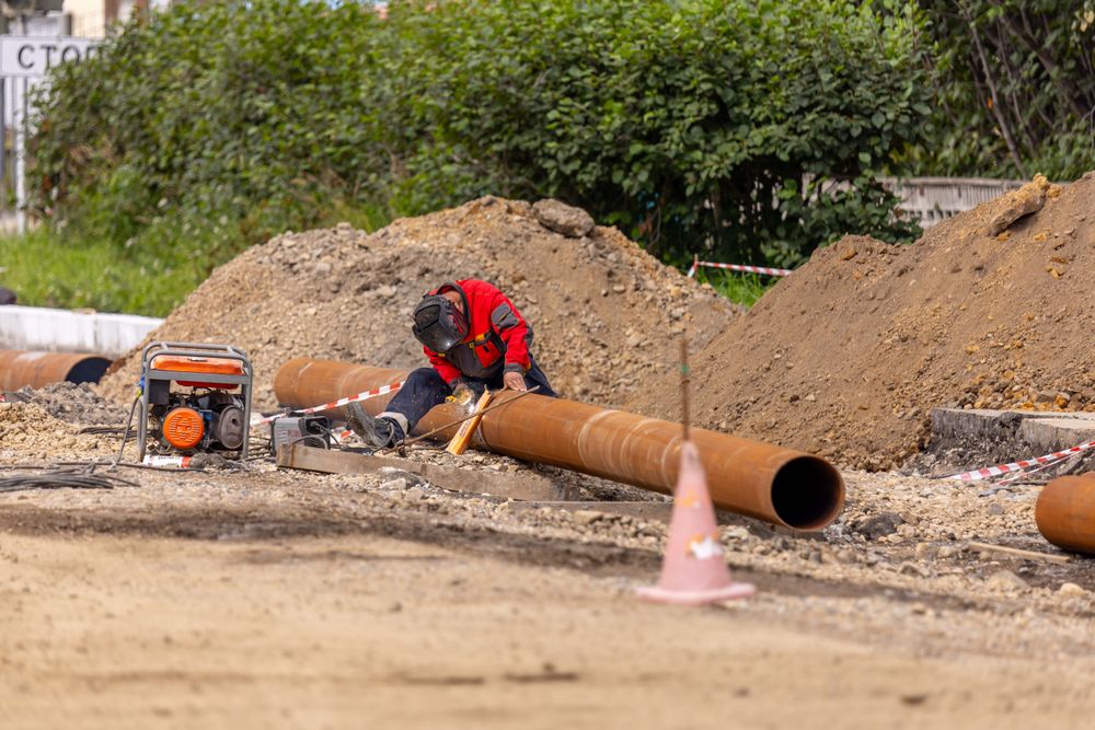 Contractor repairing pipes