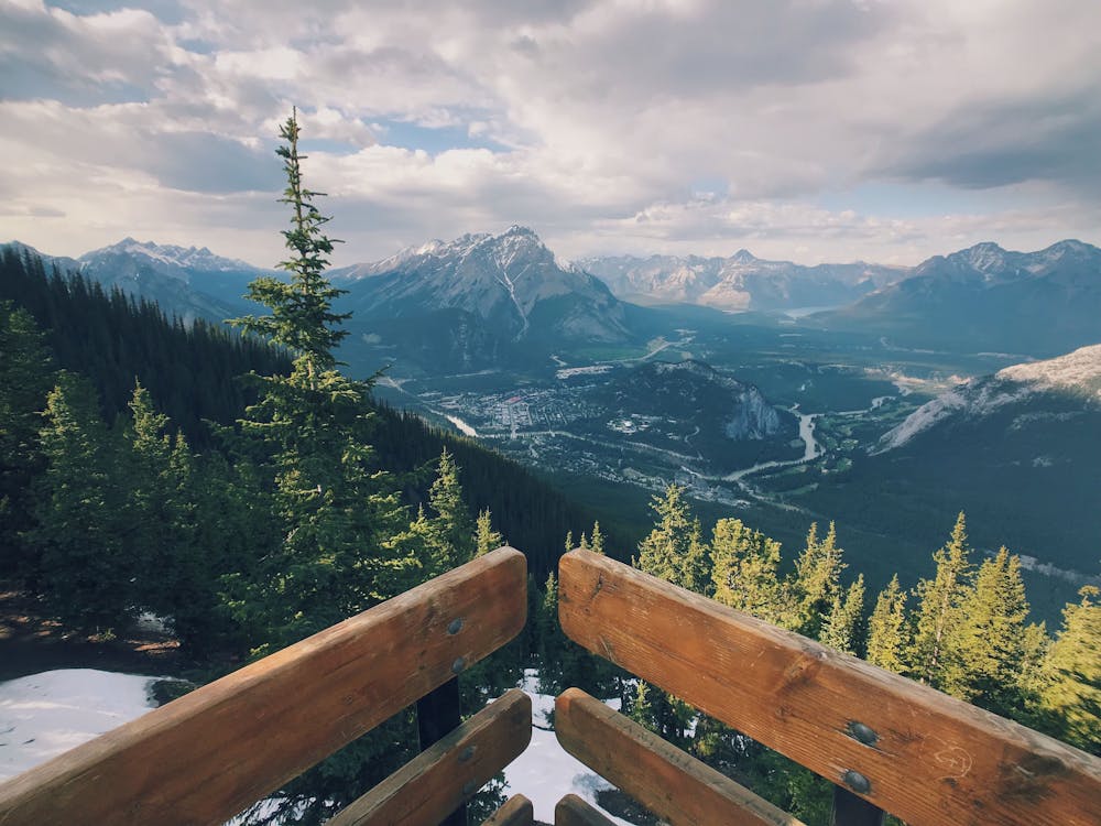 Scenic View Of Mountains Under Cloudy Sky