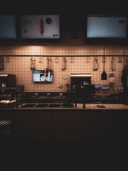 Low-lit, modern restaurant counter in Berlin with a minimalist design.