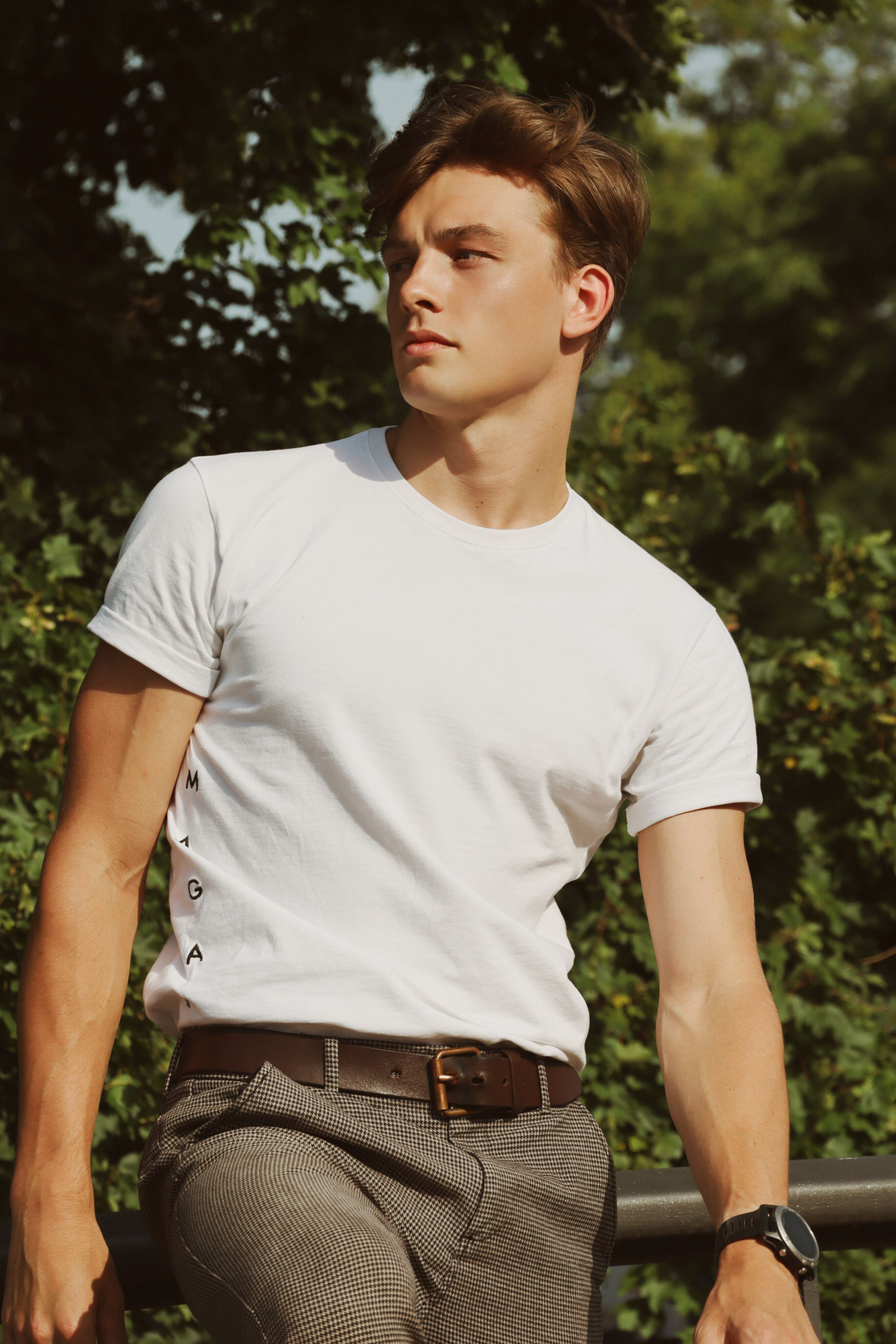Fashion portrait of a male model with short hair in Berlin, showcasing modern style.