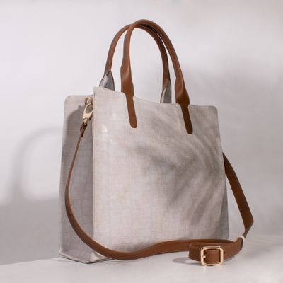 Beige embossed leather tote with tan straps, photo by Jose Martin Segura Benites on Pexels