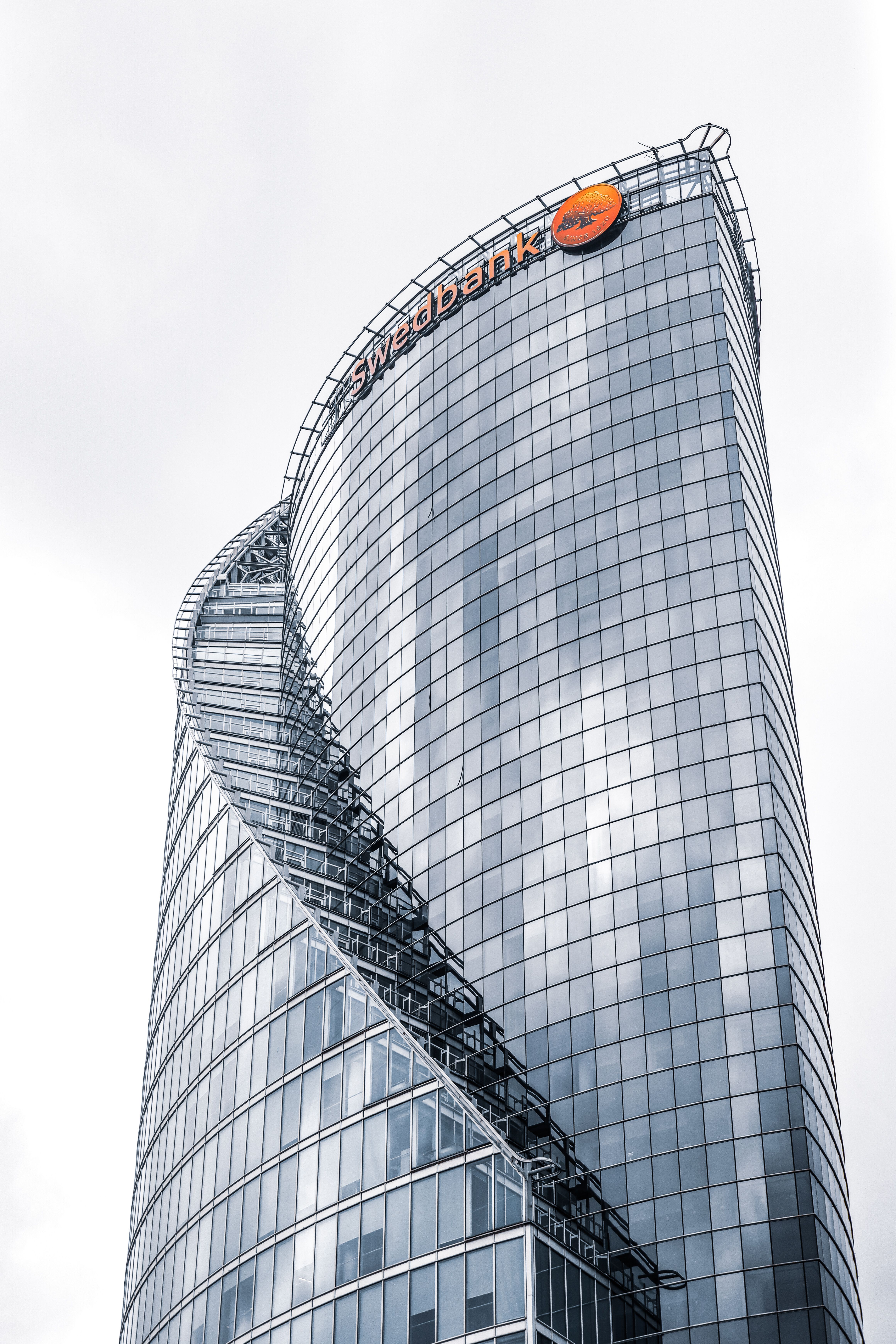 Futuristic architecture of a tall skyscraper with glass facade in Riga, Latvia.