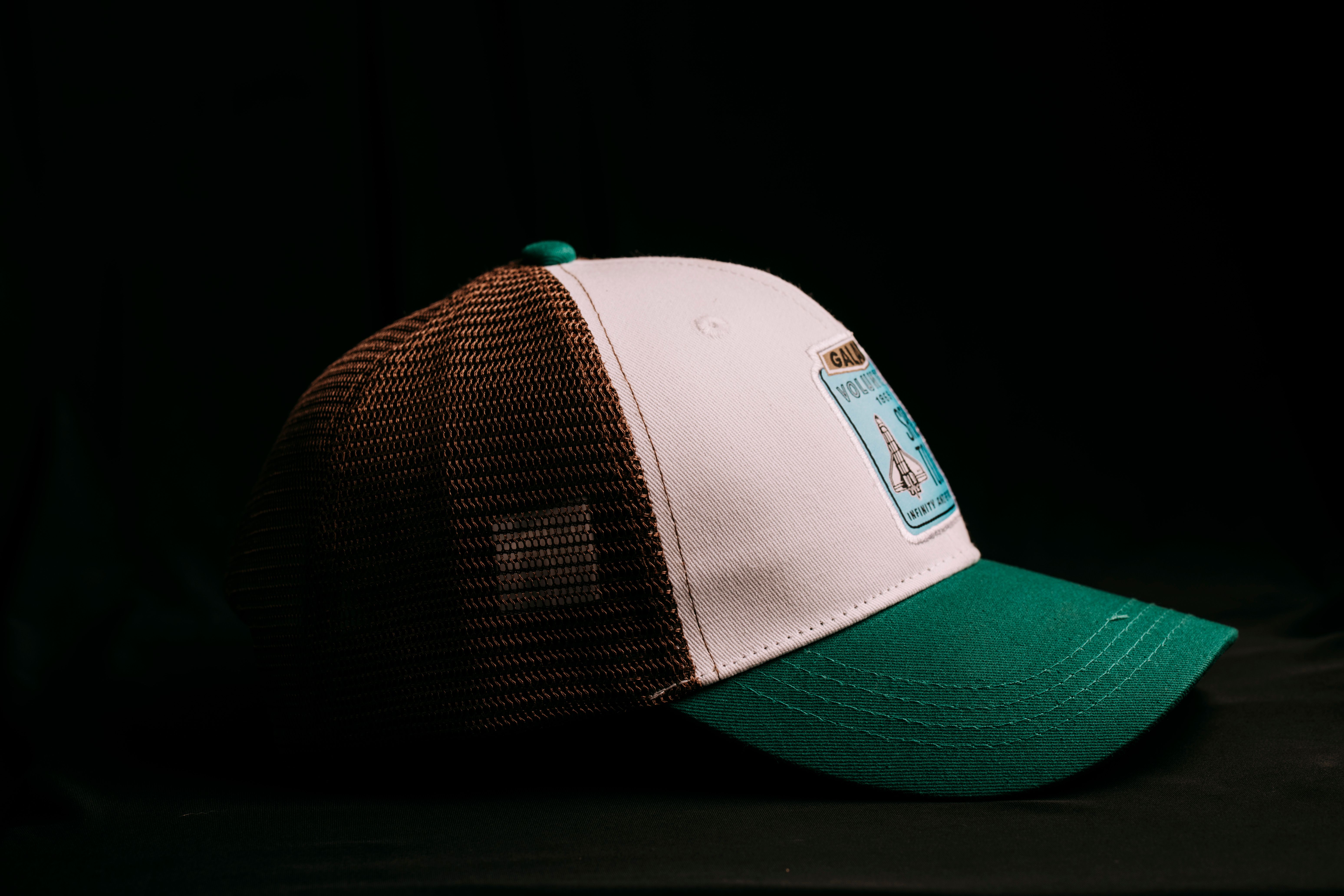 Trendy green and brown trucker hat with patch, highlight on classic design and style.