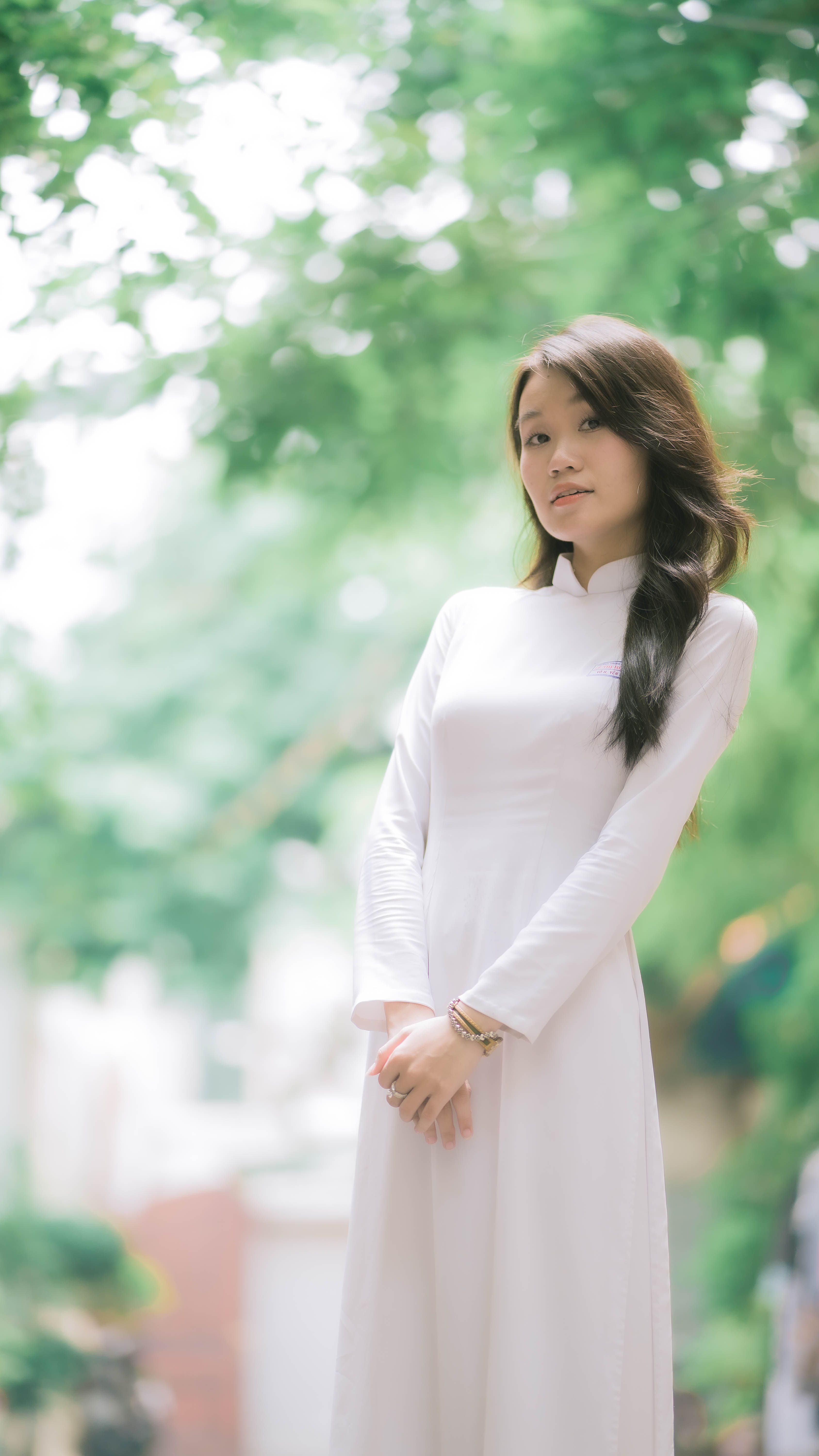 Woman in a White Dress Standing in the Park · Free Stock Photo