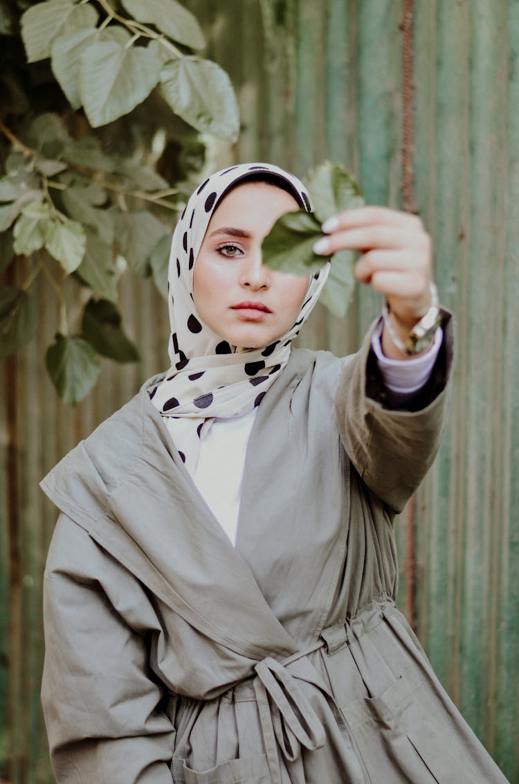 Woman Holding Leaf