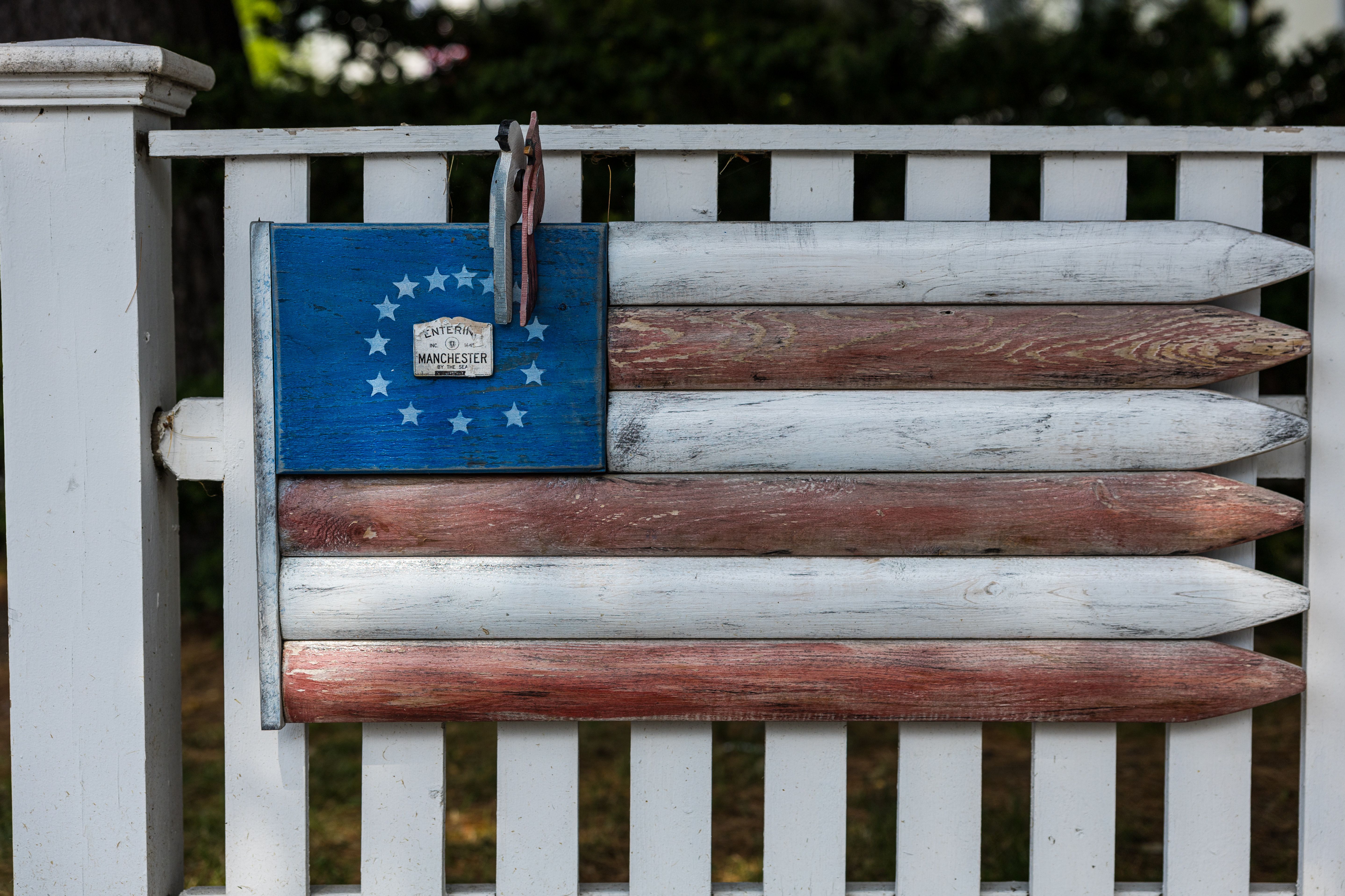 A Flag on a Fence · Free Stock Photo