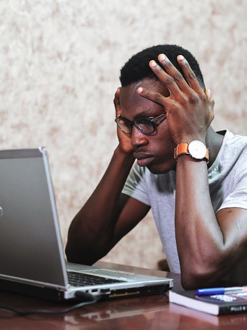 Free Man Working Using A Laptop Stock Photo