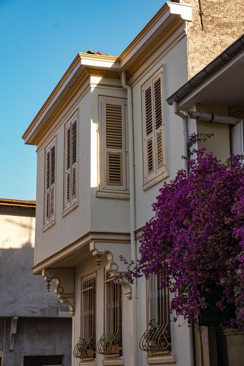 Free Explore a classic Turkish house with blooming flowers capturing the essence of Bursa's architecture. Stock Photo