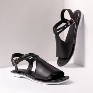Black leather sandals — photo by José Martin Segura Benites on Pexels