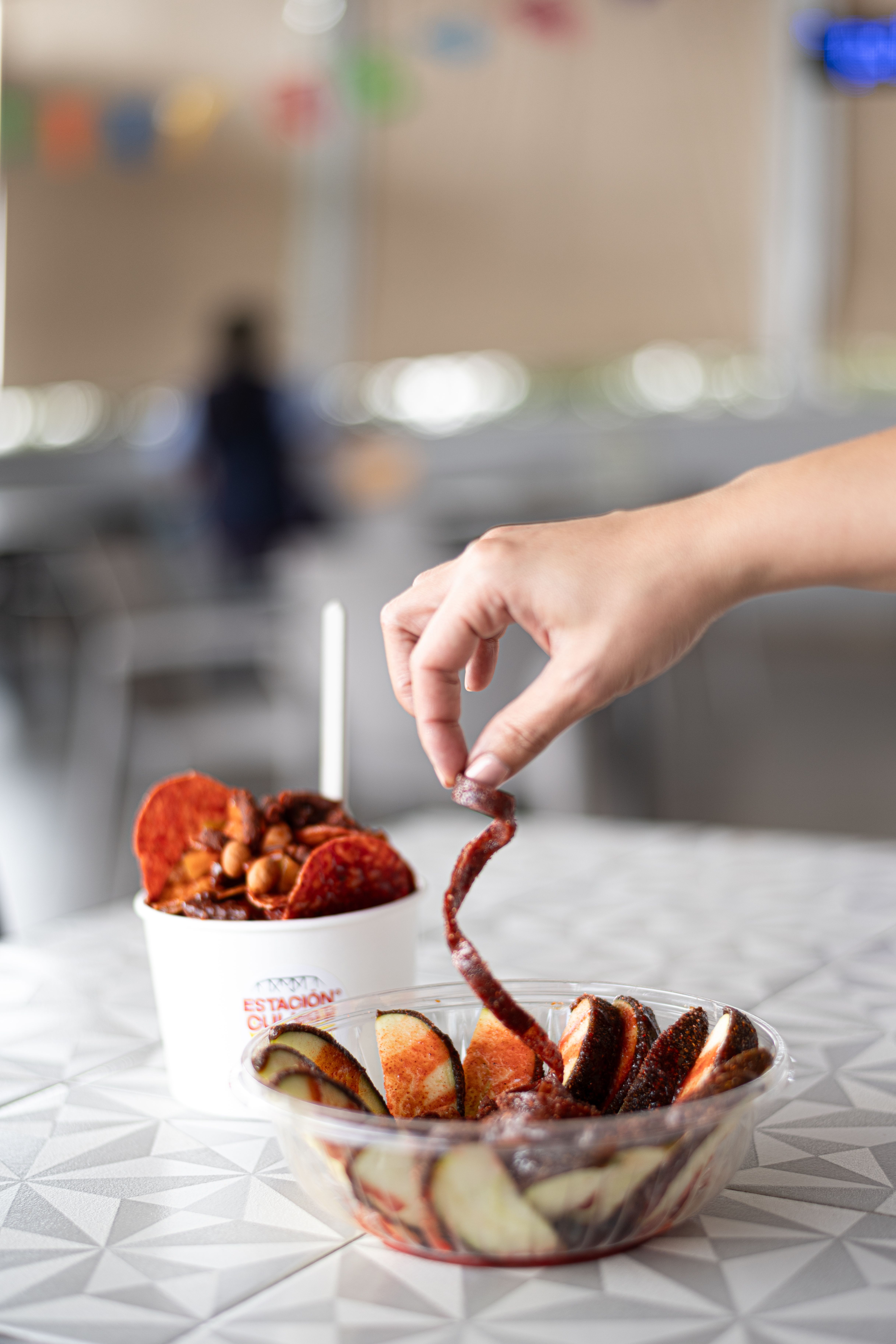 Hand of a Woman Eating a Snack · Free Stock Photo