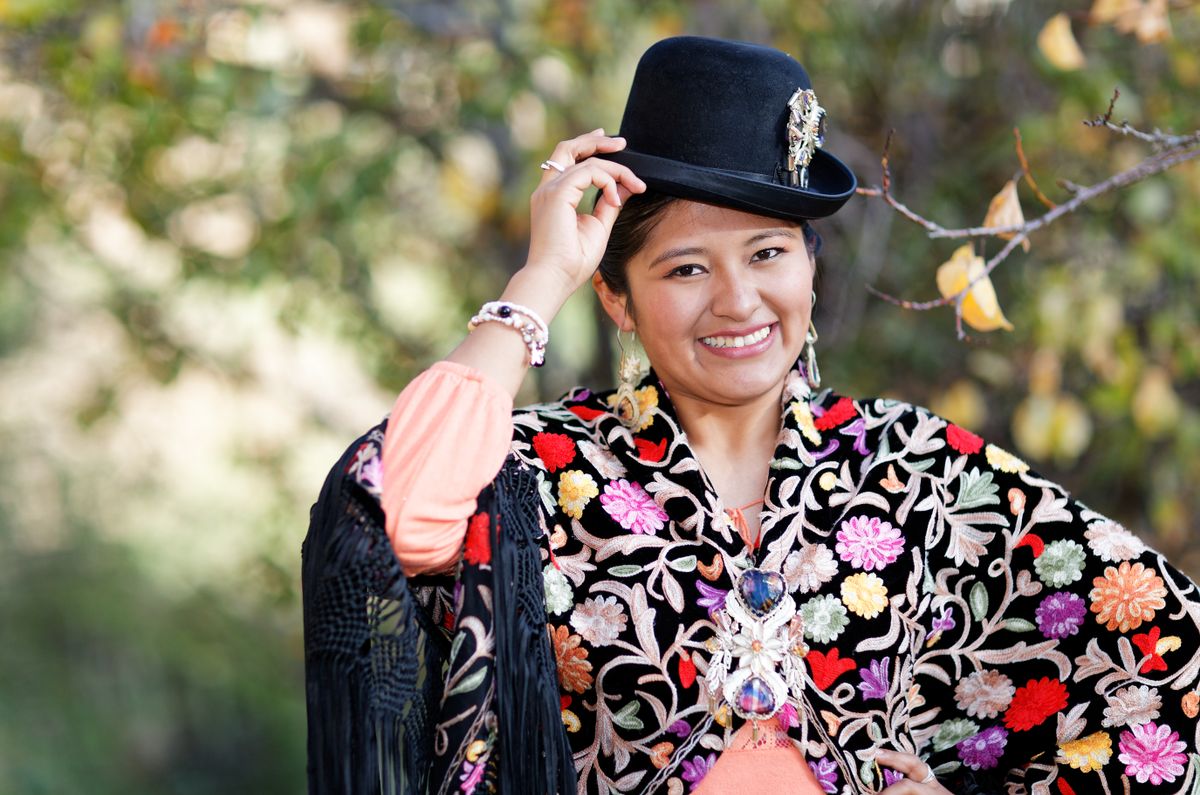 The pollera, the aguayo and the bowler hat are not costumes — they are daily clothing worn by millions of Bolivians. What each garment is, where it came from, how it changes by region, and how to look at it respectfully.
