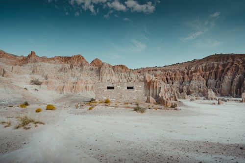 Free Explore stunning rock formations under a vibrant sky at Cathedral Gorge in Panaca, Nevada. Stock Photo