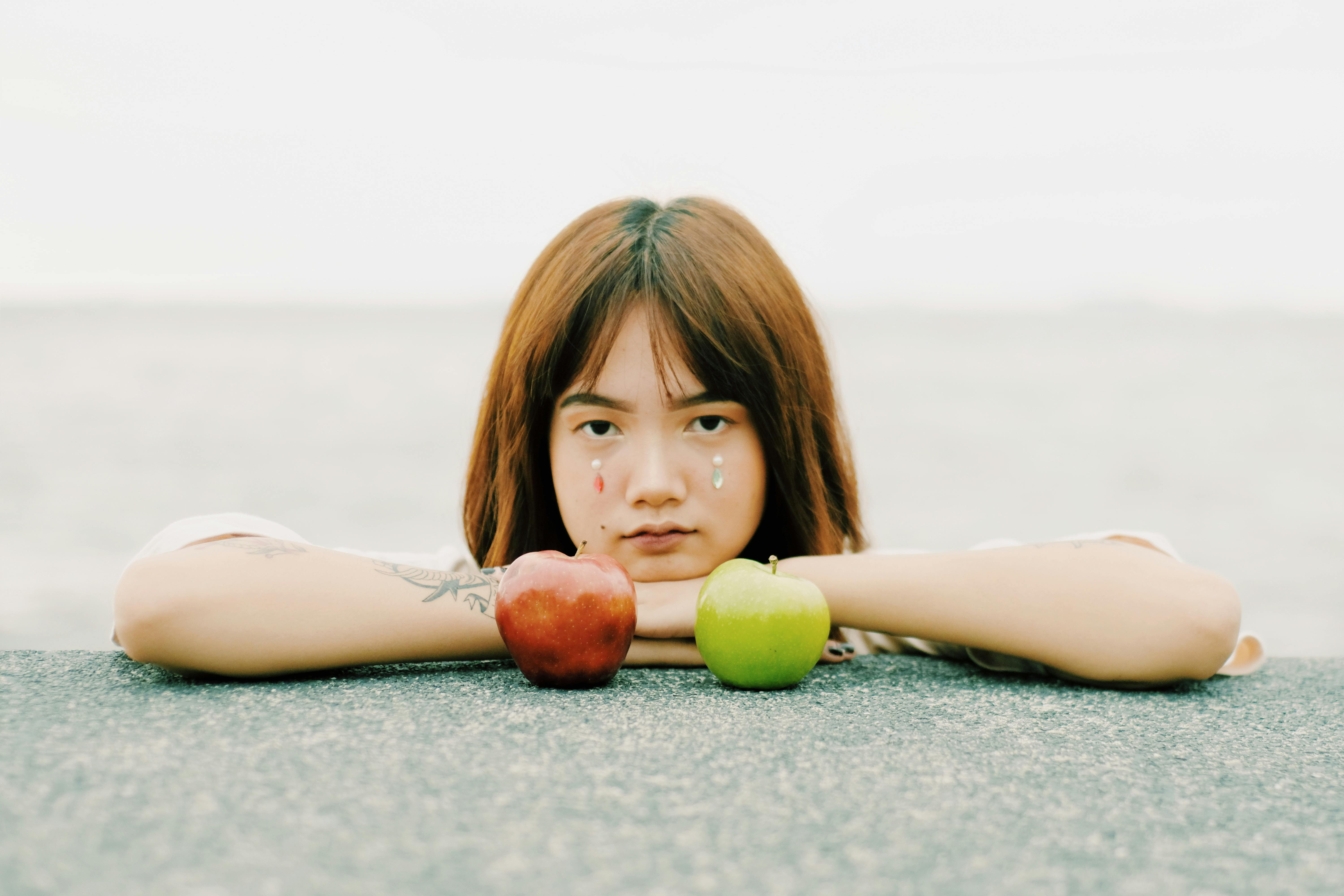 Photo Of Woman Near Apples