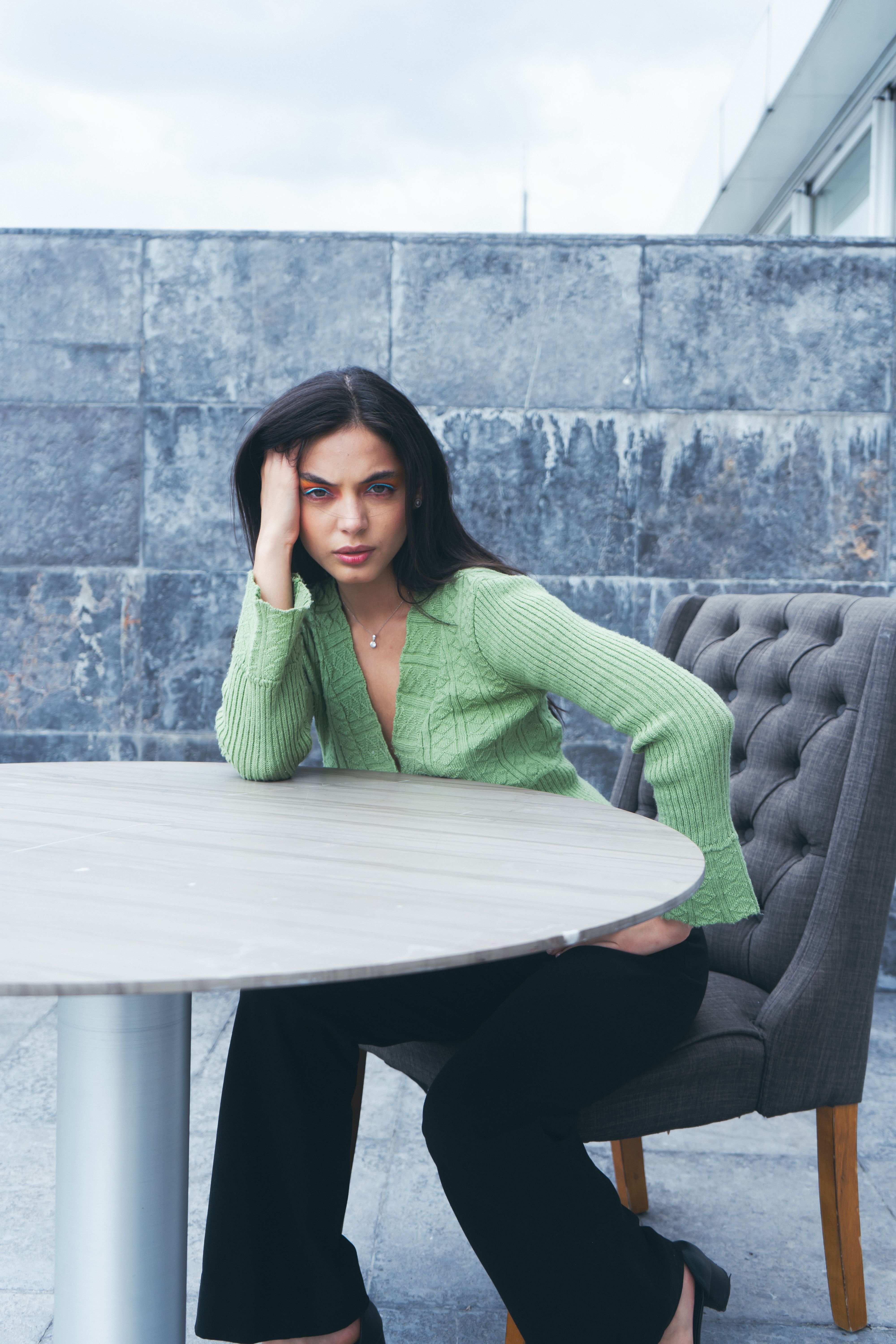 Young Woman Sitting at a Table · Free Stock Photo