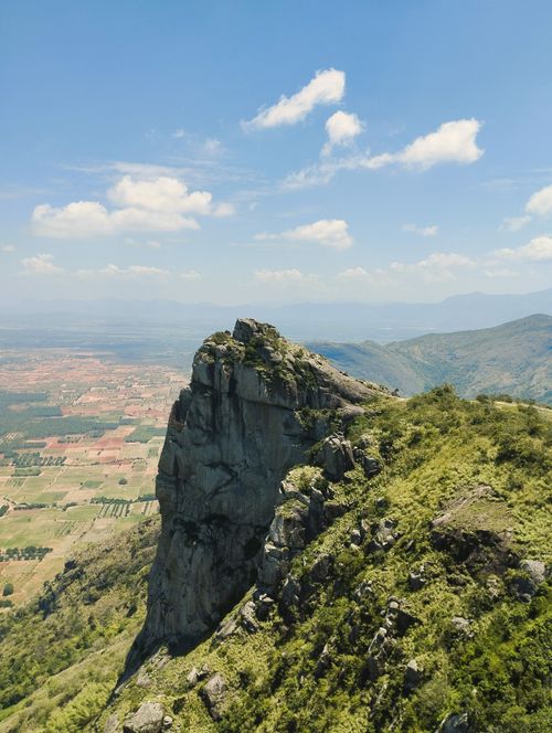 Free A breathtaking aerial view of a rocky cliff overlooking a scenic valley in Periyar, India. Stock Photo