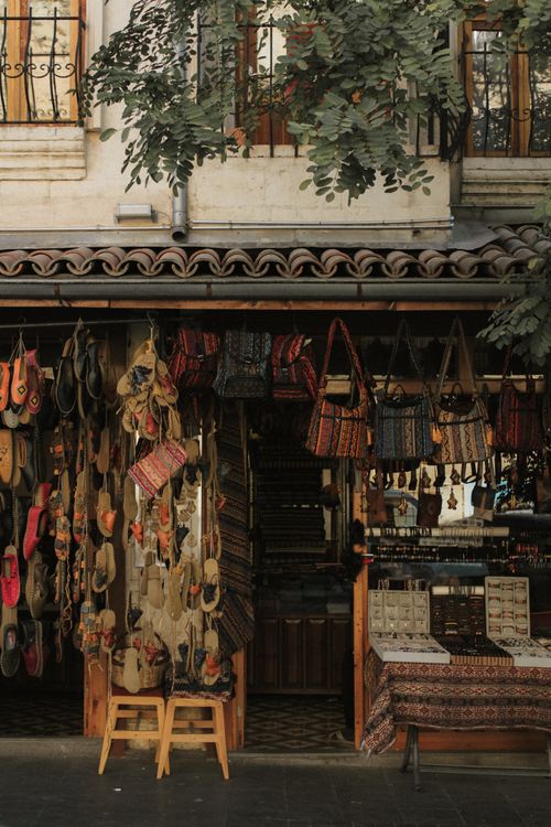 Free Explore a vibrant traditional market stall showcasing handmade bags and souvenirs in Gaziantep, Türkiye. Stock Photo
