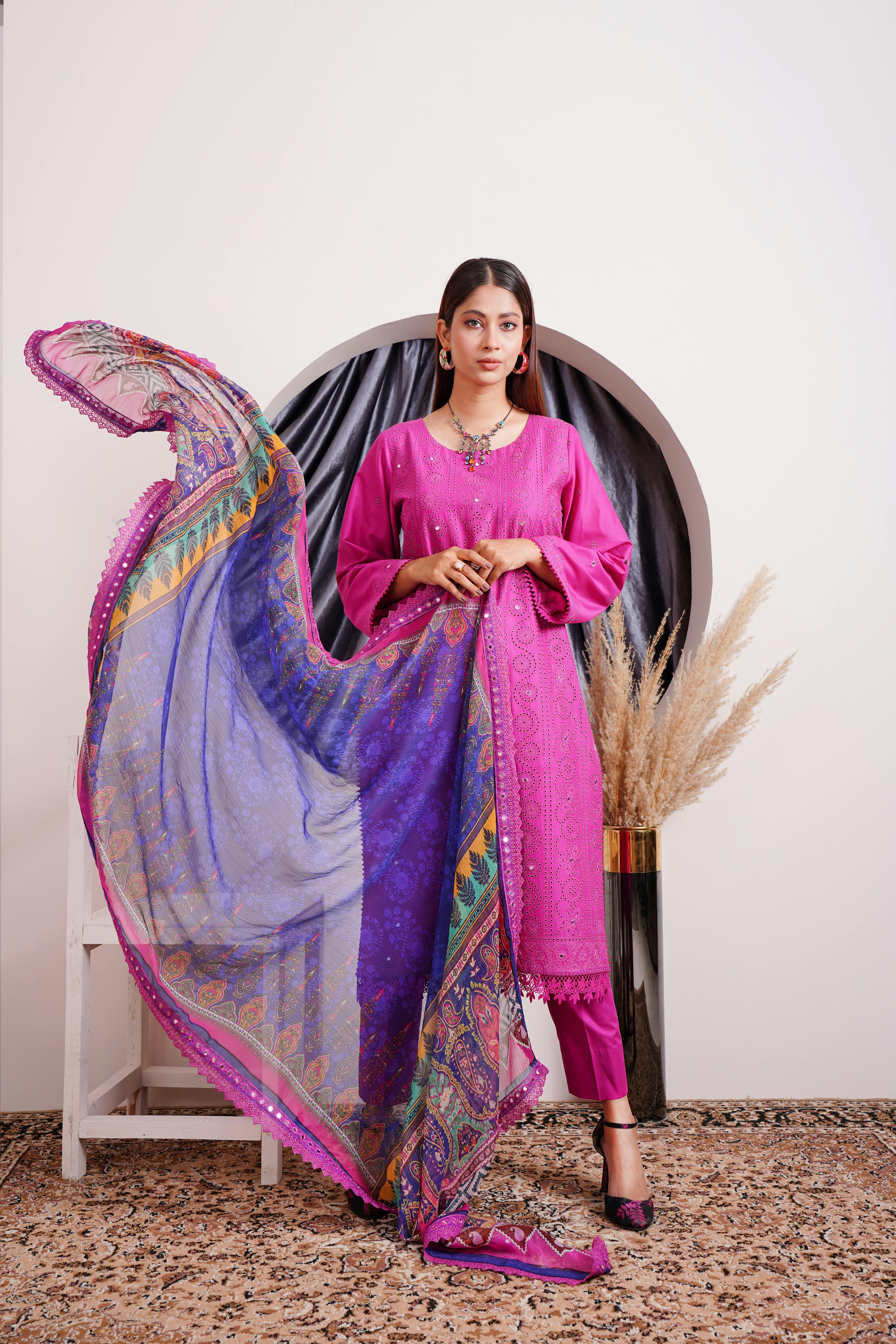 woman in pink traditional dress and with shawl