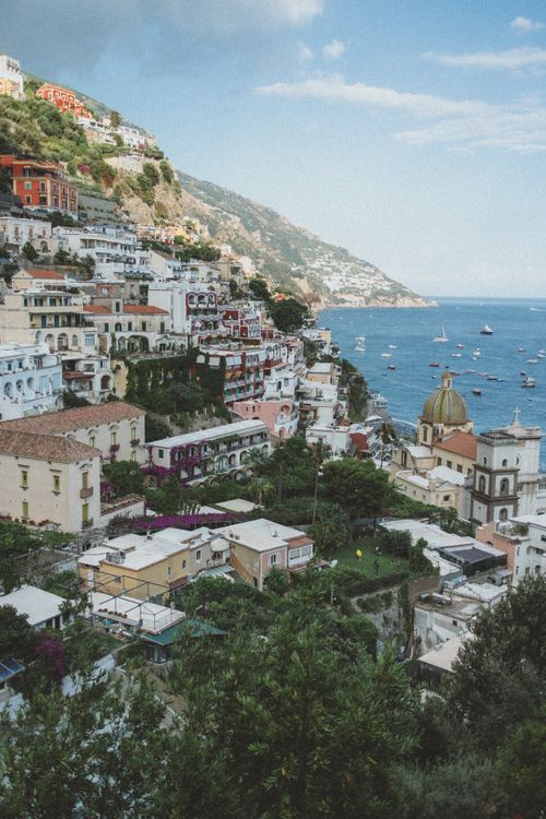 Free A picturesque view of Positano's colorful hillside buildings and the beautiful Amalfi Coast. Stock Photo