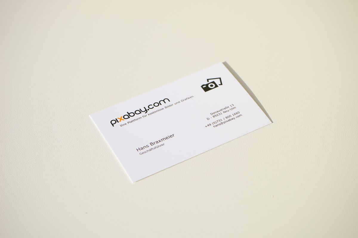 Stack of freshly printed business cards ready to ship.