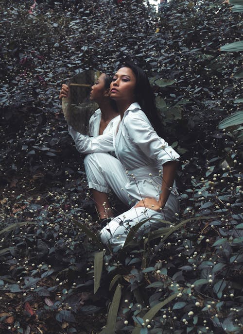 Photo of Woman Wearing White Jumpsuit