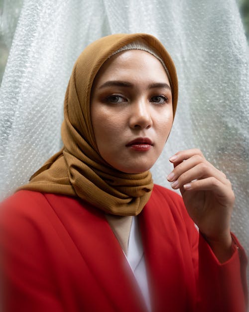 Woman in Red Blazer With Brown Hijab 