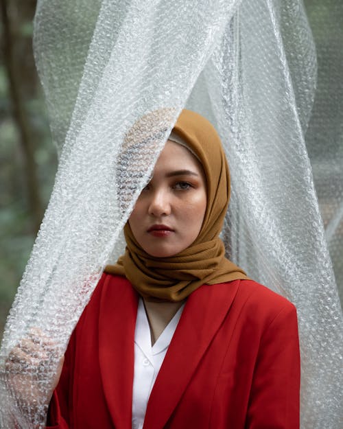 Woman Wearing Red Blazer And Hijab
