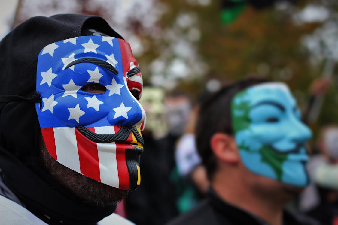 Free Close-Up Photo of Person Wearing Guy Fawkes Mask Stock Photo