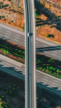 Drone shot of a highway overpass in Garipçe, İstanbul, showcasing vibrant landscape.