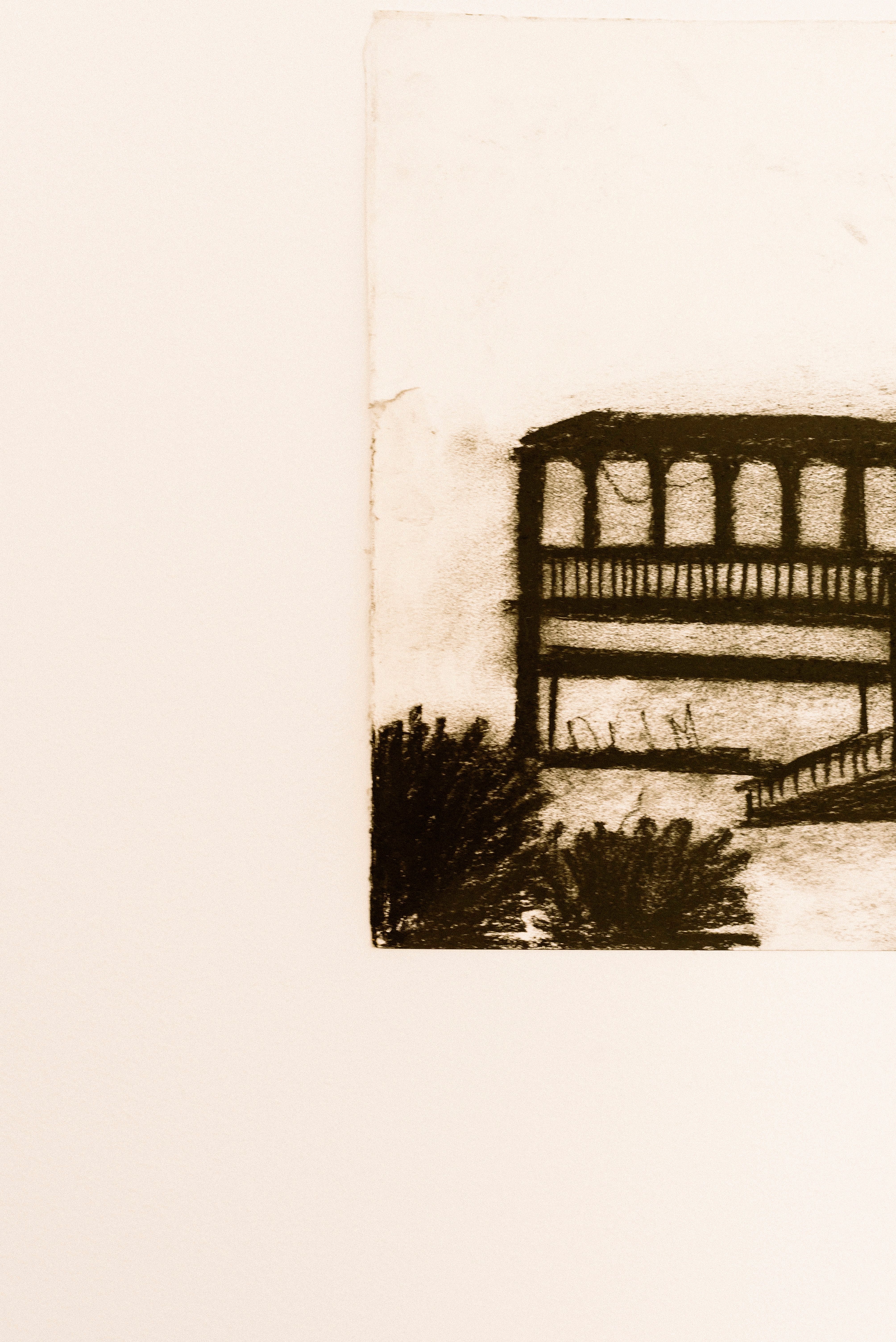 Artistic charcoal sketch of a balcony with foliage on a minimalist beige background.