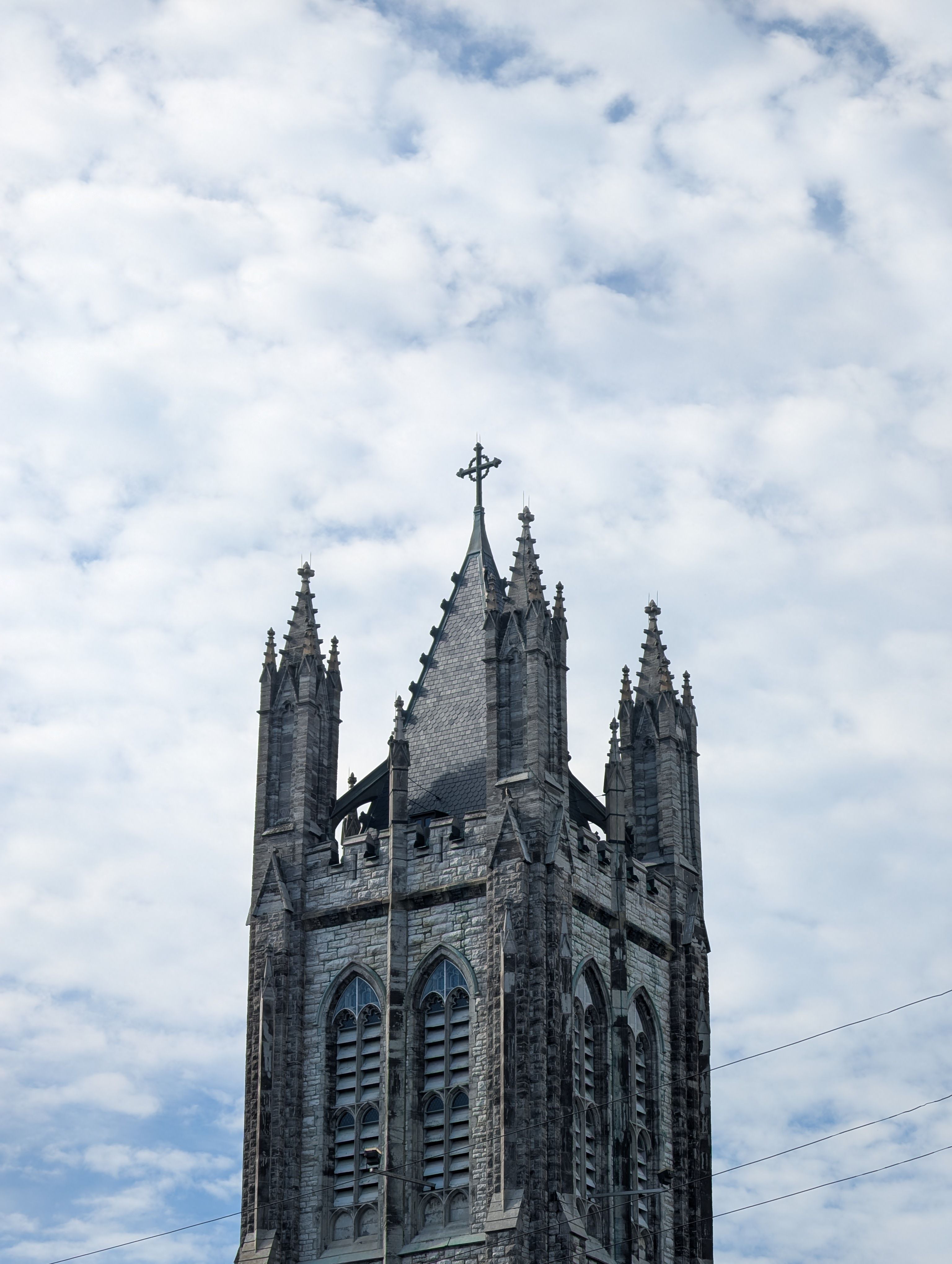 St. Mary's Cathedral spire against a cloudy sky in Kingston, Ontario.