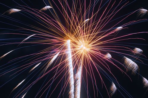Free Colorful fireworks explode in the night sky, illuminating the darkness with vibrant colors and patterns. Stock Photo