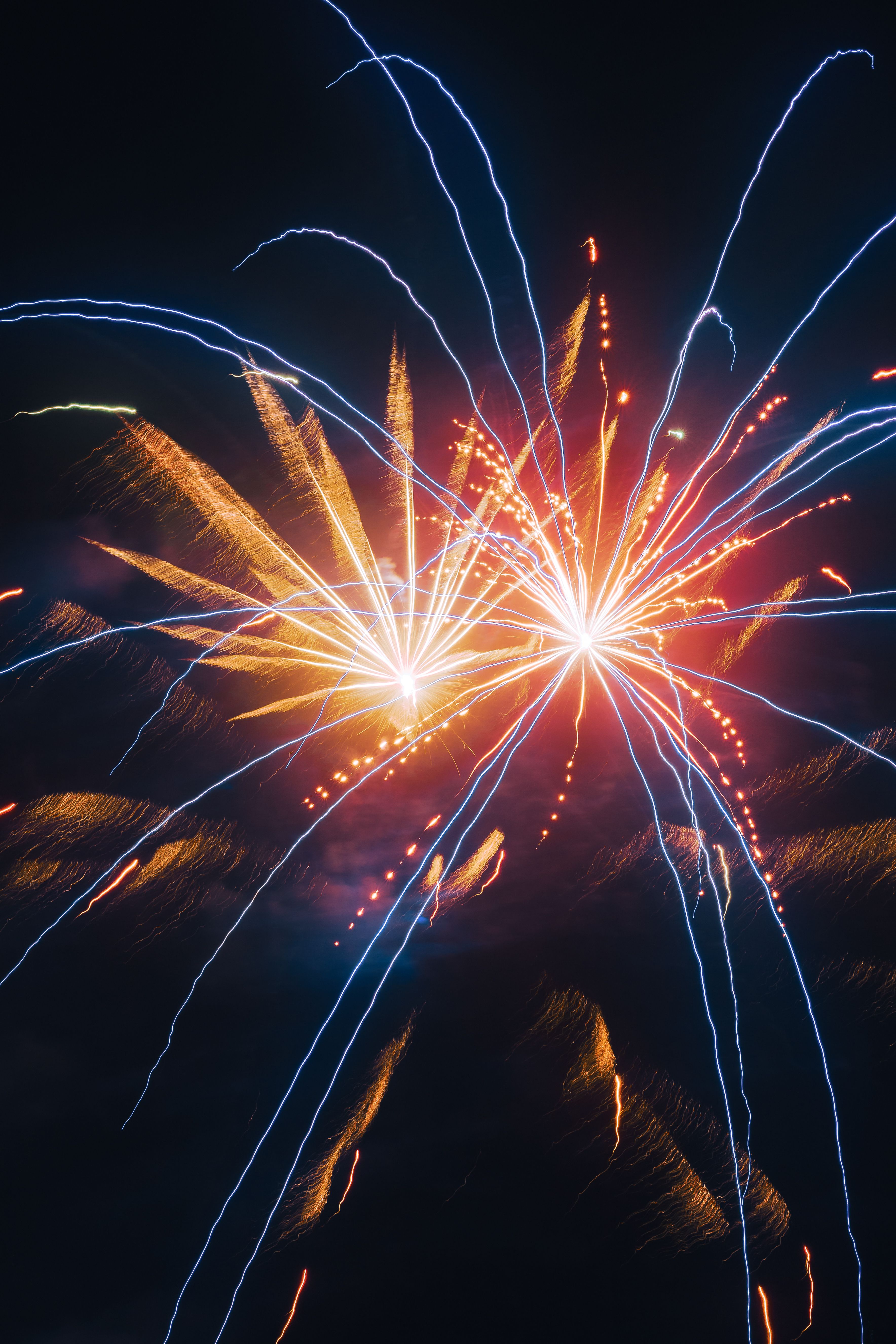 Colorful fireworks illuminate the night sky in a stunning celebration display.