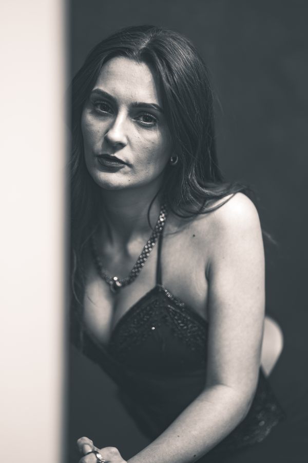 Woman in a backless halter top, black and white