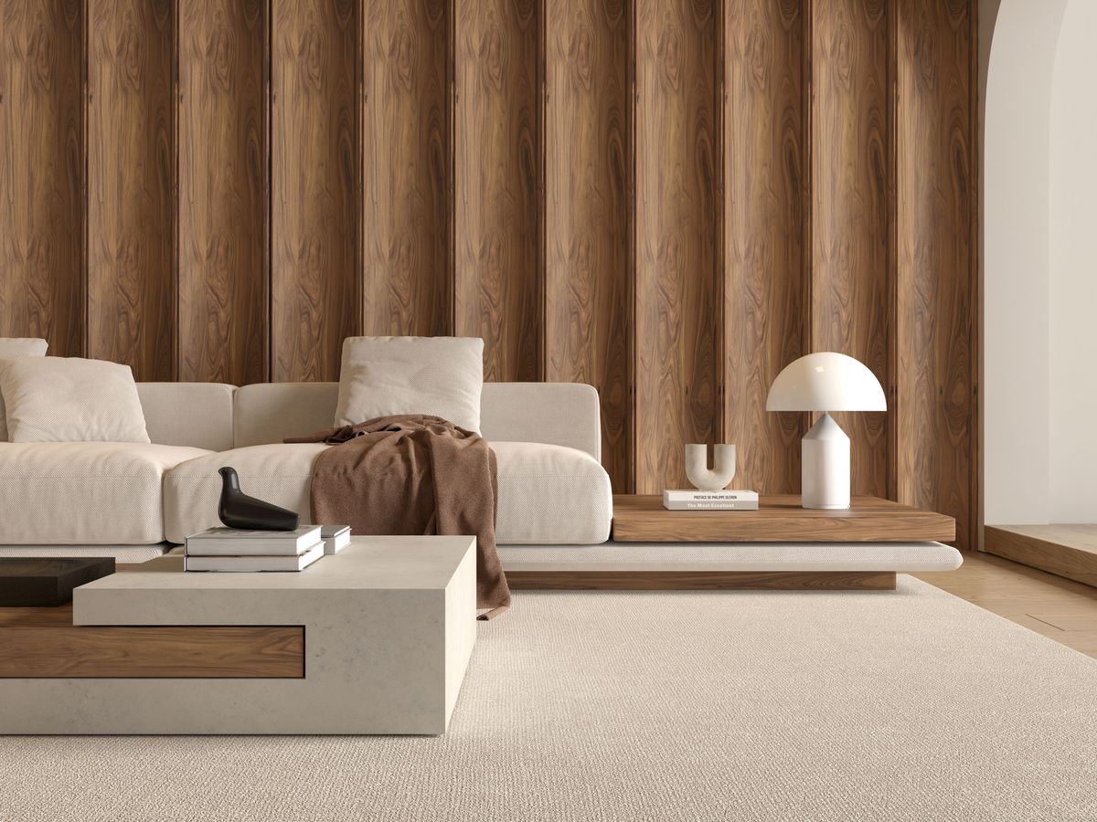 Stylish minimalist living room with sofa, coffee table and ambient lighting