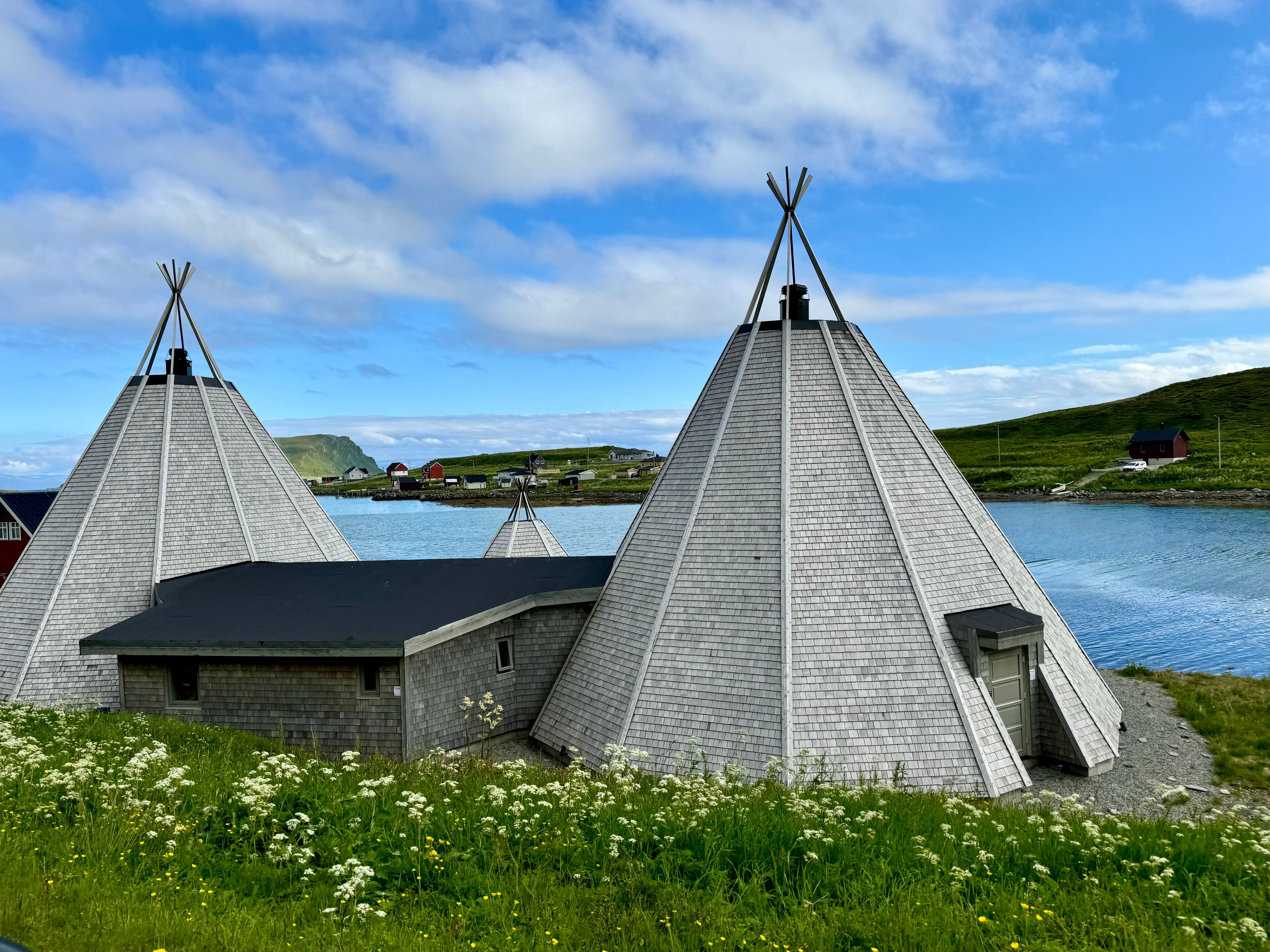 Houses in Shapes of Tipi by River in Countryside · Free Stock Photo