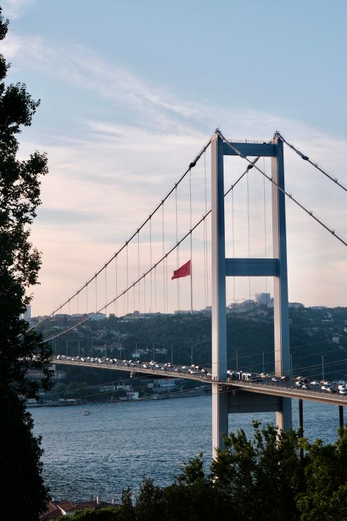 Free Scenic view of Fatih Sultan Mehmet Bridge over the Bosporus during sunset in Istanbul, Turkey. Stock Photo