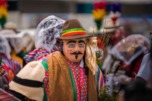 Free Traditional festival scene featuring colorful masks and costumes, showcasing cultural celebration. Stock Photo