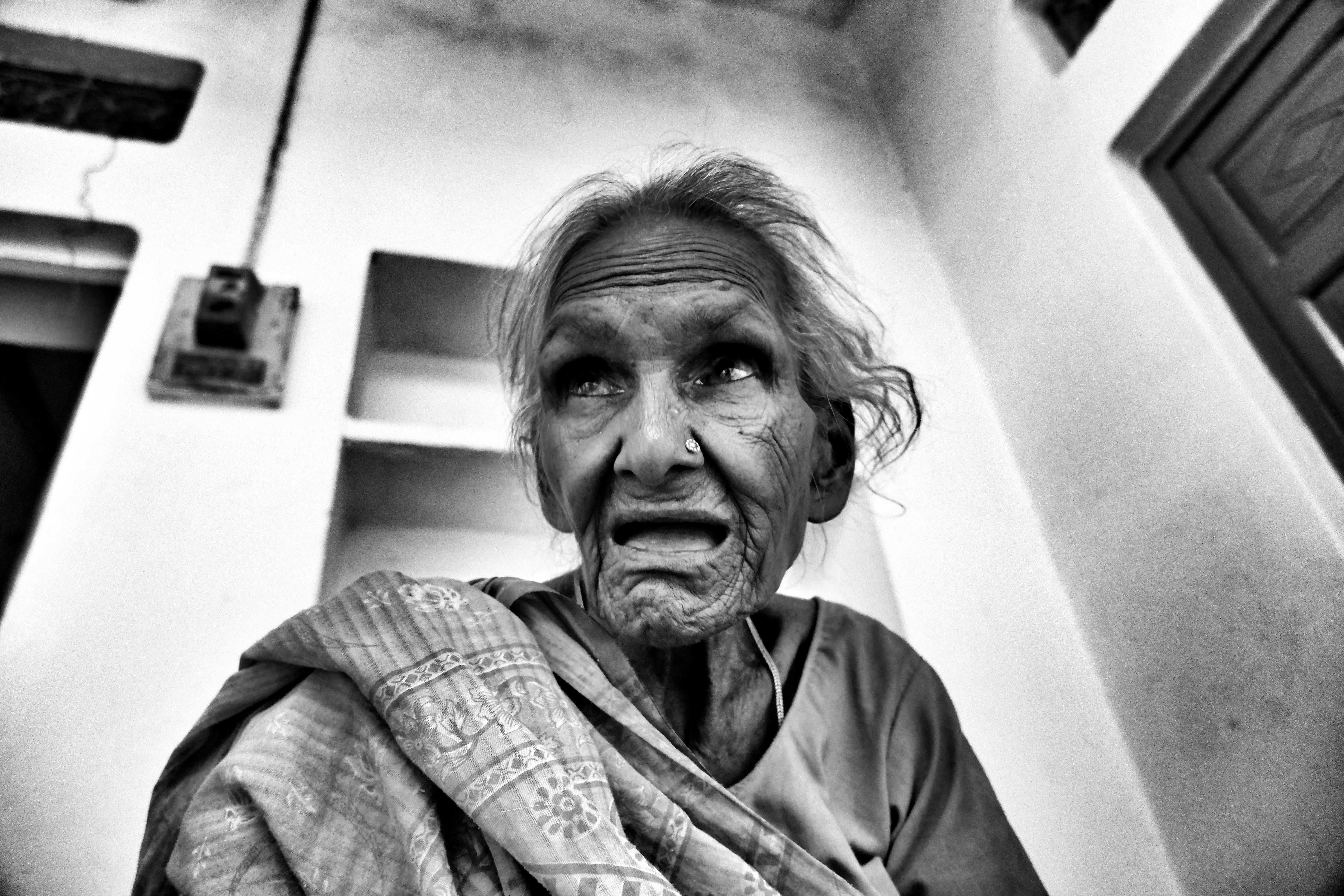 Person watching football on a television with friends cheering