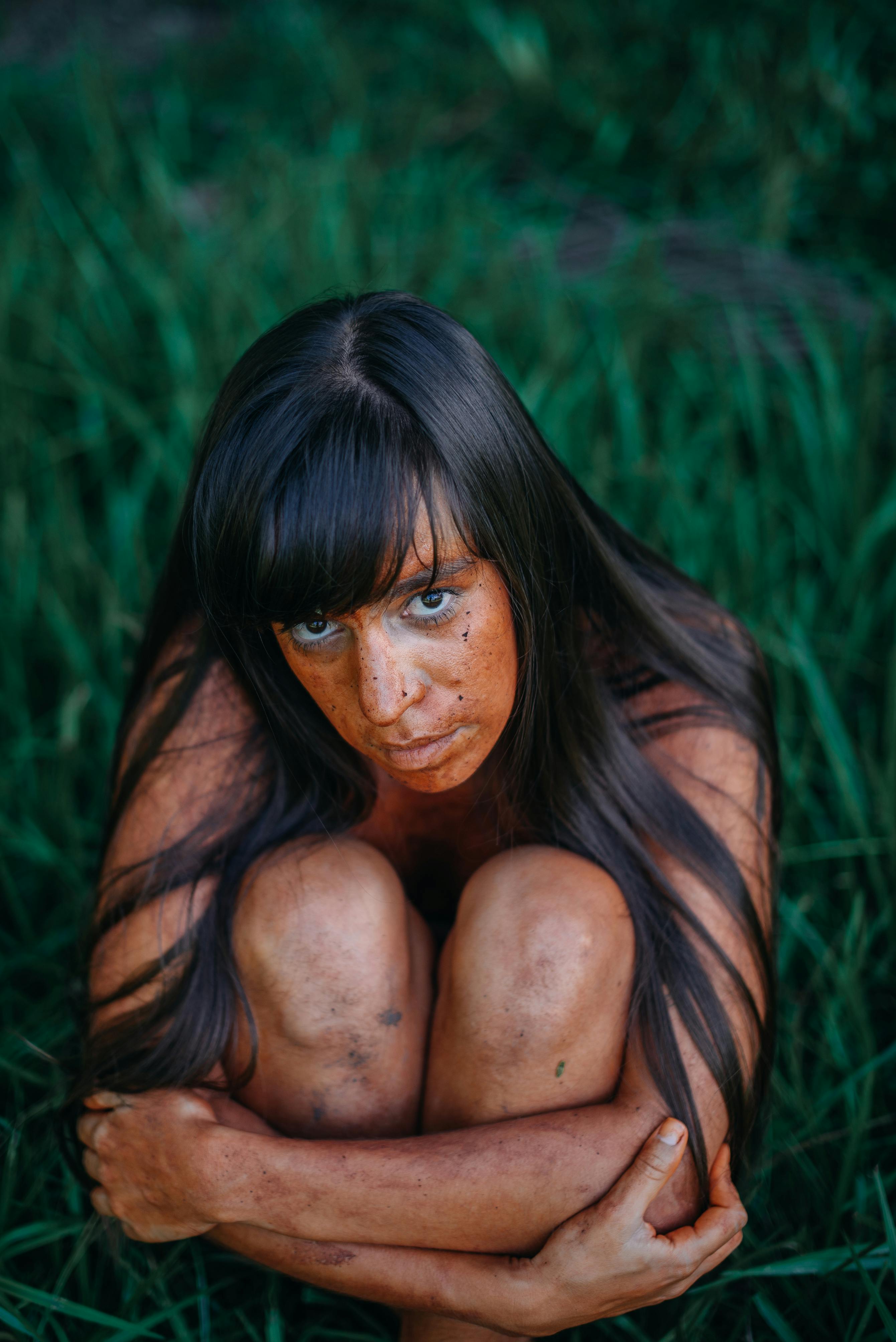 Fast bowler running in to bowl during a cricket match