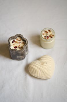 A minimalist still life featuring artisan candles in unique shapes, creating a serene and elegant atmosphere.