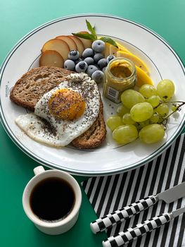 A delicious breakfast with fruit, toast, and coffee on a vibrant setting in Istanbul.