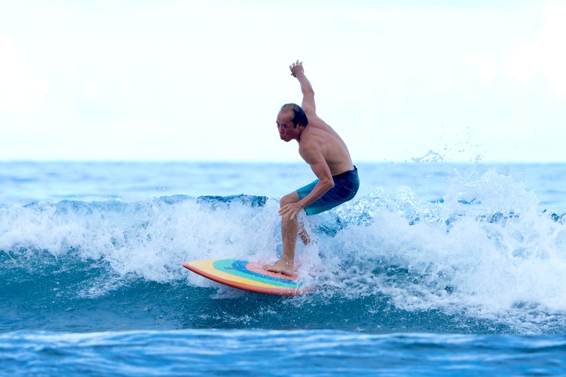 Surfboard Riding Surfer Balancing on a Surfboard · Free Stock Photo