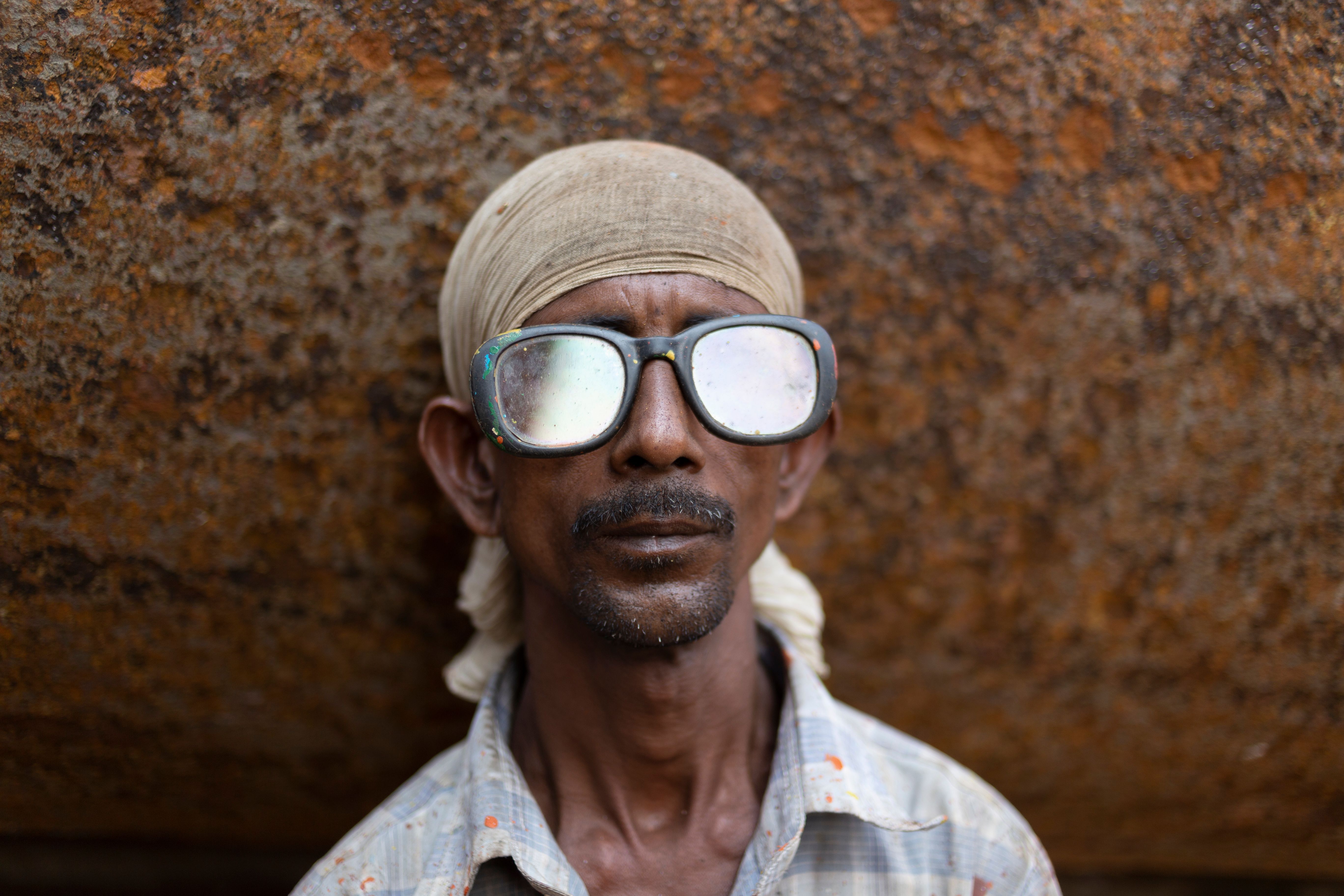 Portrait of a Man with Mustache Wearing Sunglasses and a Headscarf ...