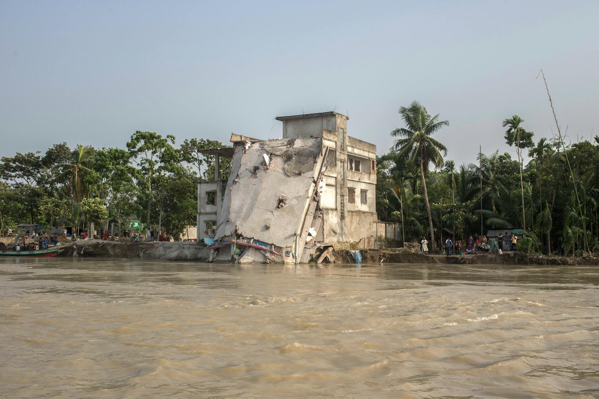 An Abandoned, Damaged House on the Shore