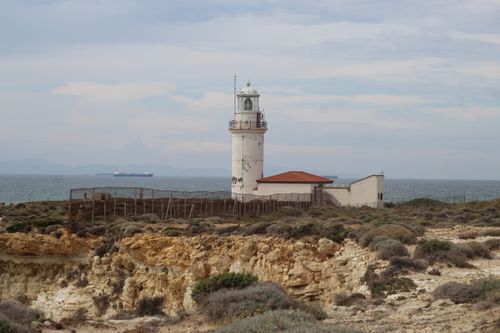 Free Scenic view of a lighthouse on a rocky coastline by the Mediterranean Sea in Turkey. Stock Photo
