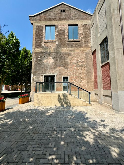 Free A brick building exterior in Tianjin, China under bright summer sunlight. Stock Photo