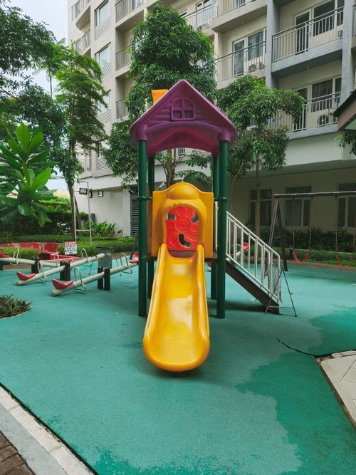 Free Colorful playground slide in Las Piñas, Philippines residential complex. Stock Photo