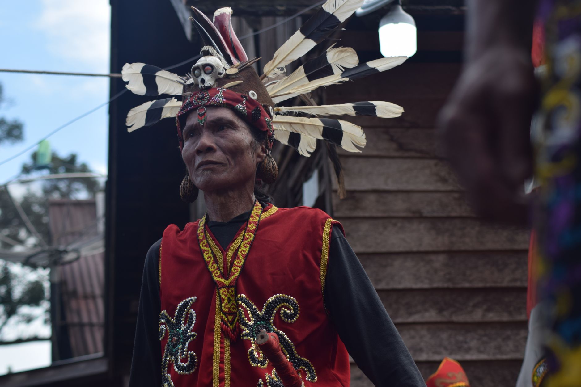 A Dayak man in traditional costume during a festival in Kalimantan Barat, Indonesia.