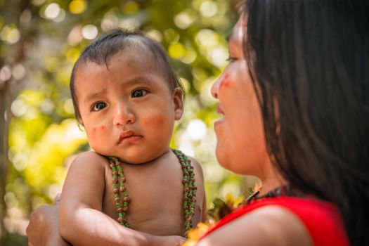 Portrait of Tribal Woman Holding a Baby 